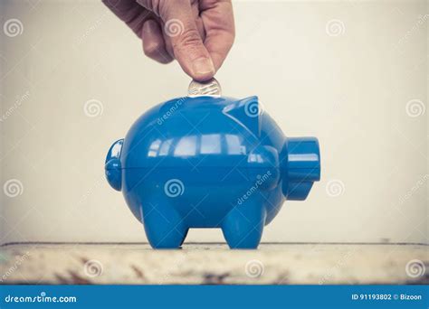 Adding Coins To The Piggy Bank Stock Photo Image Of Currency Safe