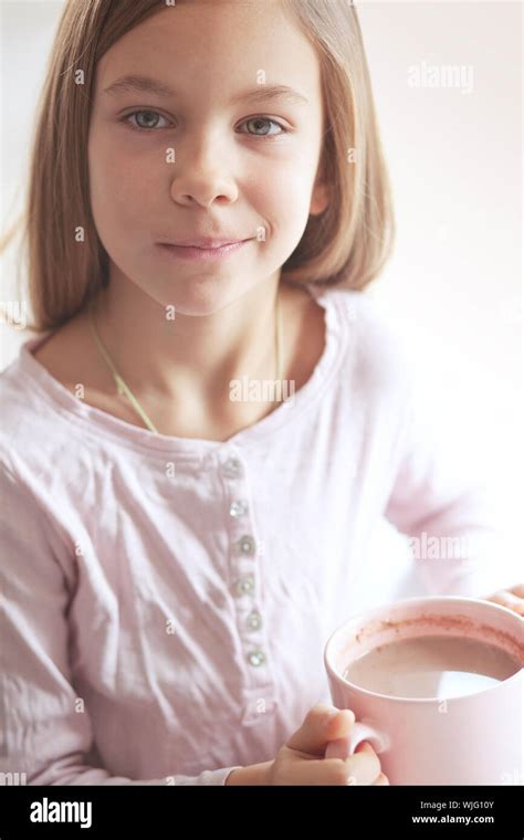 Years Old Girl Drinking Hot Cocoa From The Big Pink Cup Stock Photo Alamy