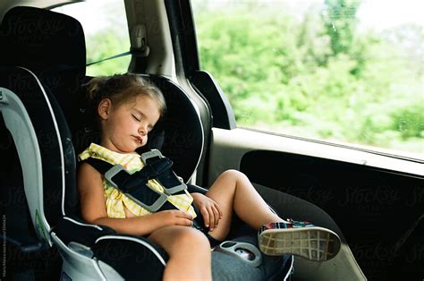 "Little Girl Sleeping In Carseat" by Stocksy Contributor "Maria Manco ...