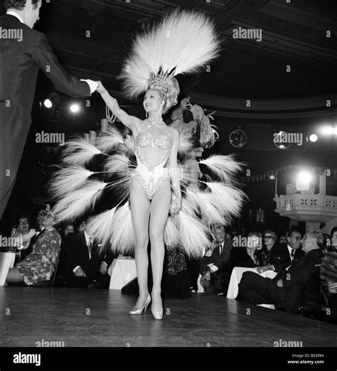 Paris Lido Feature. Cabaret dancers perform on stage at a night club in ...