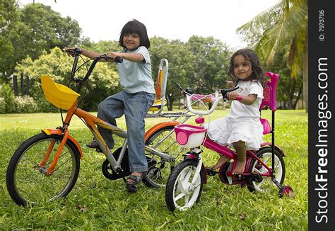 Girl In The Garden Riding Her Cycle Free Stock Images Photos