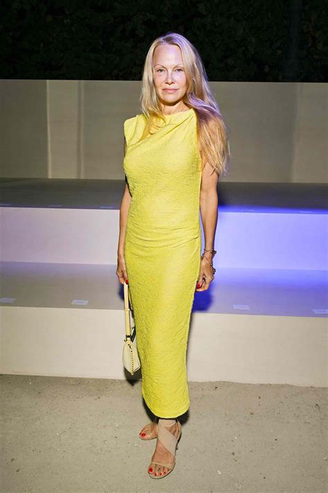 Pamela Anderson Stuns In Yellow Dress During Paris Fashion Week