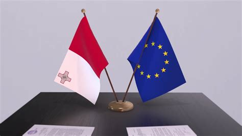 Malta And EU Flag On Table Politics Deal Or Business Agreement With