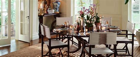 A Dining Room Table With Chairs And Vases On Top Of It In Front Of Two