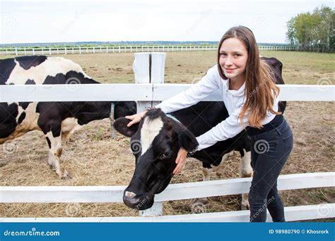 Attractive Girl Hug Cow Baby Looking At Camera And Smiling Friendship