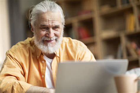 Closeup Of Happy Old Man Using Notebook At Home Stock Image Image Of