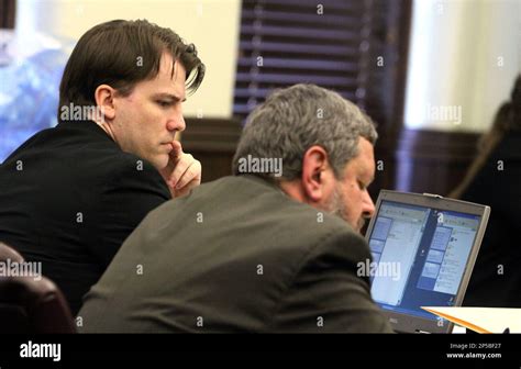 Brett Seacat Sits Beside His Attorney Roger Falk During His Trial