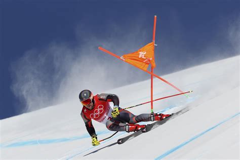 Winds limit Olympic downhill competitors' practice runs | AP News