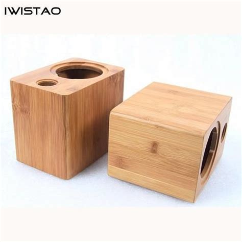 Two Small Wooden Containers Sitting Next To Each Other