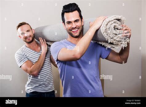 Gay Couple Moving Into New Home Stock Photo Alamy