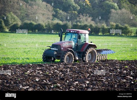 Tractor Ploughing Field Stock Photo Alamy