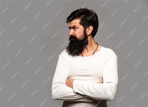 Premium Photo Portrait Of Confident Serious Man Has Beard And Mustache Looks Seriously