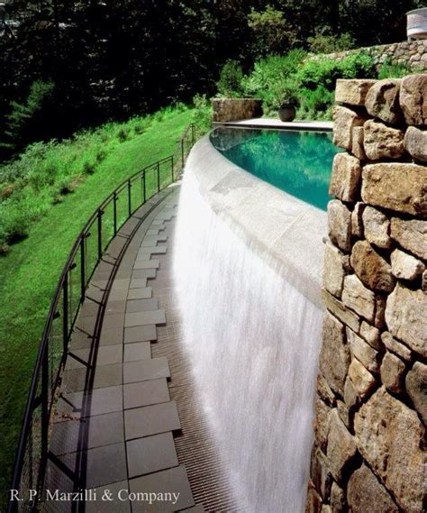 Infinity edge pool, waterfall, granite stone, field stone wall ...