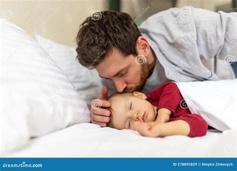 Handsome Brunette Father Kissing Sleeping Infant Baby Tenderly Stock Image Image Of Daughter