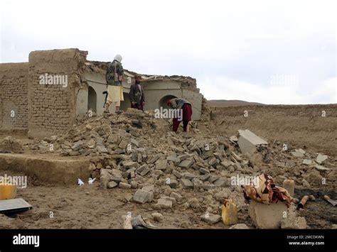 Afghan Villagers Remove Bricks After Their Home Was Damaged By Monday S