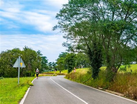 Premium Photo Pilgrim With Backpack Walking The Camino De Santiago In