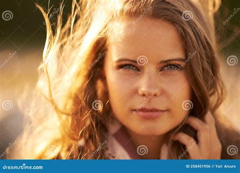 Free And Feeling It An Attractive Young Woman Outside Stock Photo