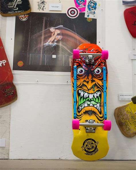 A Skateboard Is Hanging Up On The Wall Next To Other Skateboards And