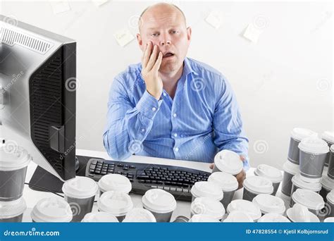 Overworked And Exhausted Businessman At The Office Stock Photo Image