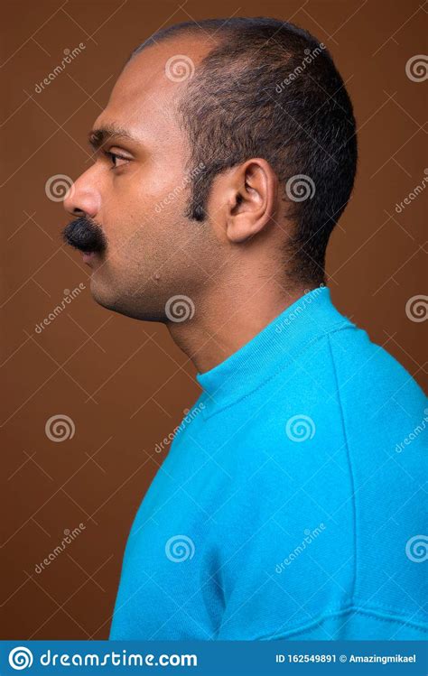 Closeup Profile View Of Indian Man With Mustache Wearing Blue Sweater Stock Image Image Of