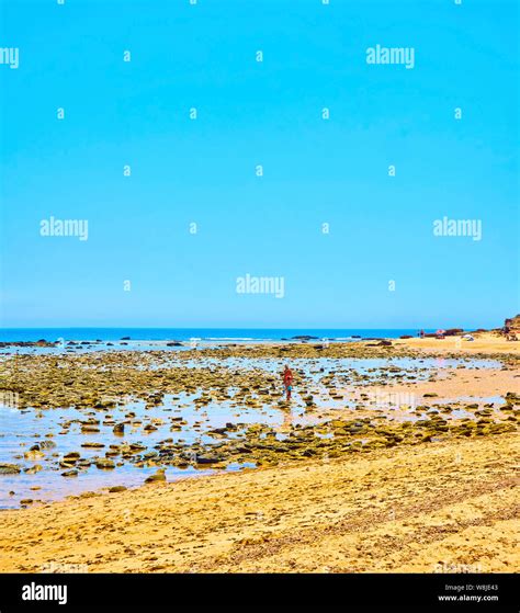 People Enjoying A Sunbathing In The Mari Sucia Beach A Broad Beach Of