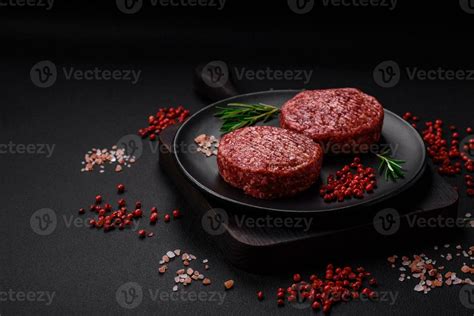 Fresh Raw Ground Beef Burger Patty With Salt And Spices Stock