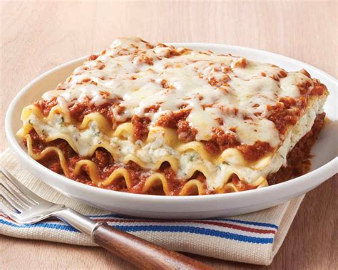 Our Lasagna Features Freshly Made Pasta Layered Between A Sweet Tomato Sauce Ground Beef And A