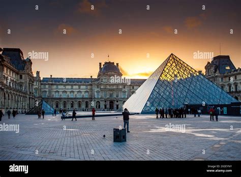 Sunset Over Louvre Museum With Iconic Glass Pyramid Stock Photo Alamy