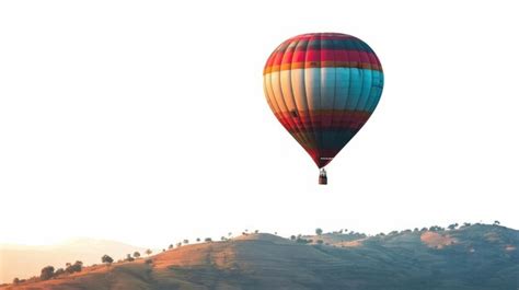 Premium Photo Hot Air Balloon Flying Over Mountain