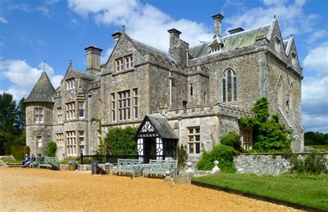 An Old Stone Building With Lots Of Windows