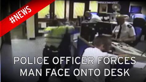 Shocking Video Shows Policeman Force Handcuffed Mans Head Onto Desk Mirror Online