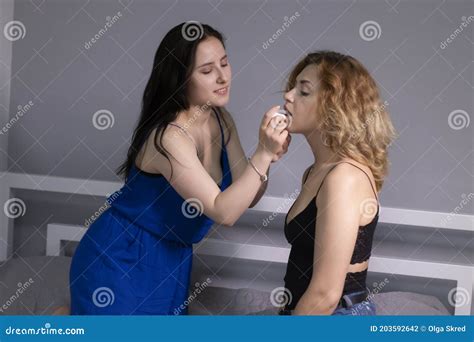 Two Pretty Teenage Girls Blonde And Brunette Do Each Others Makeup In