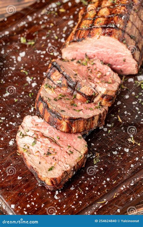 Sliced Grilled Beef Tenderloin Seasoned With Salt Rosemary And Thyme