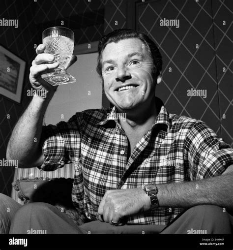 Actor Kenneth More Raises His Glass Before Having A Drink December 1956