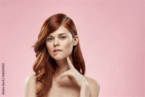 Pretty Woman With Long Beautiful Hair Grooming Hairstyle Glamor Naked Shoulders Pink Background