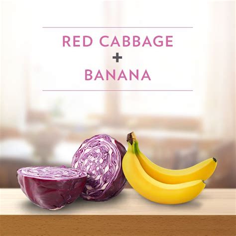 Red Cabbage And Banana Next To An Onion On A Wooden Table With Blurry