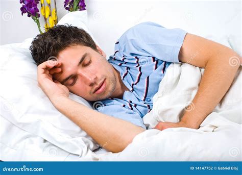 Young Man Sleeping In Bed Stock Photography - Image: 14147752