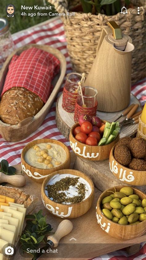 An Image Of Food On A Table With Bread And Other Foods In Bowls Around It