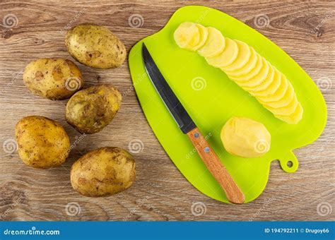 Few Raw Potatoes Peeled Potato Slices Of Potato Knife On Cutting