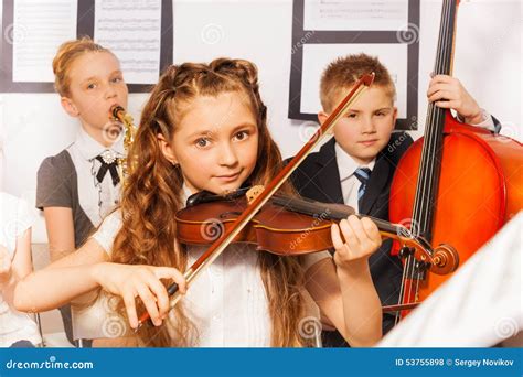 Group of kids playing musical instruments together