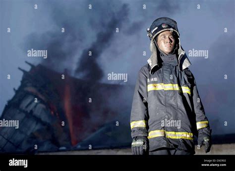 Firefighters Try To Put Out The Remaining Fire After Blasts Hit Two Oil