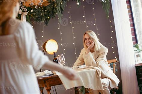 Lesbian Couple Having Dinner In A Restaurant Girl Giving A T To Her