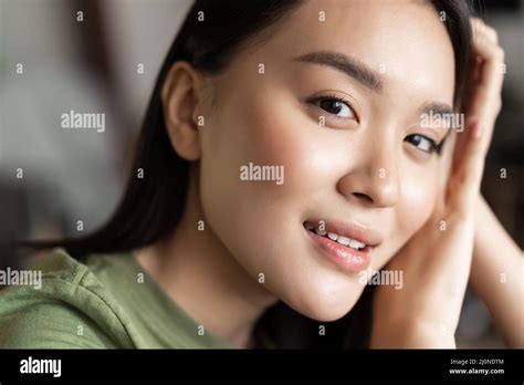 Close Up Portrait Of Beautiful Asian Woman Gazing Tenderly At Camera