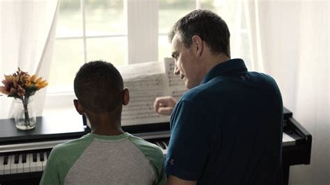 father  son playing piano  stock video