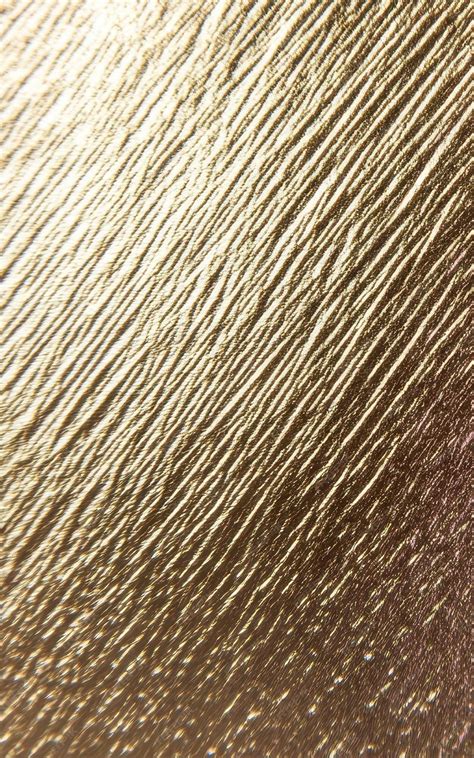 Gold colored brushed metal texture | Premium AI-generated image