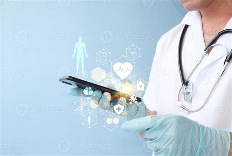 Doctor Of Medicine Touches An Electronic Medical Record On A Smart