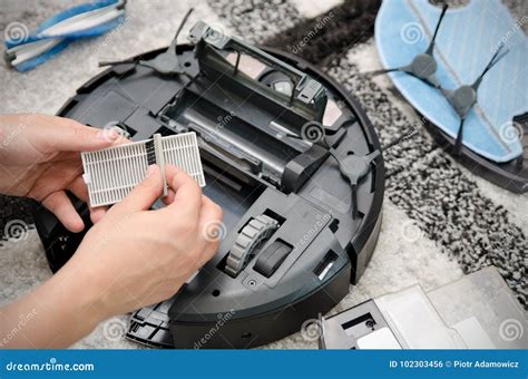 Robotic Vacuum Cleaner Maintenance Stock Photo - Image of automatic ...