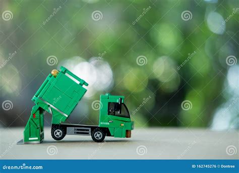 Miniature Green Plastic Garbage Truck. Children Toy Stock Photo - Image ...