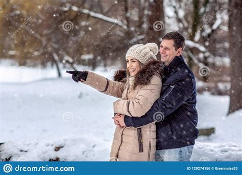 Couple Hugging and Enjoying Outdoors on Beautiful Winter Day Stock ...