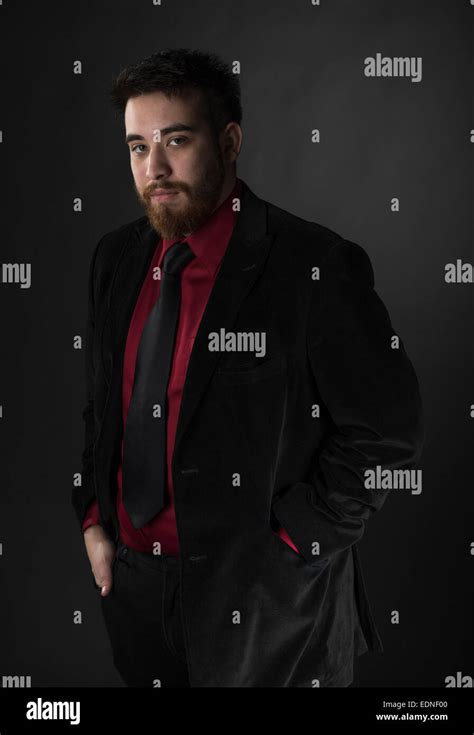 Young Man Wearing Maroon and Black Formal Attire Stock Photo - Alamy